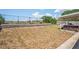 Spacious backyard area with a retaining wall offers ample space for outdoor activities and recreation at 6137 Halifax Dr, New Port Richey, FL 34653