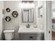 Stylish bathroom with a modern vanity, decorative shelves, and contemporary fixtures at 6137 Halifax Dr, New Port Richey, FL 34653