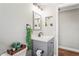 Well-lit bathroom with modern fixtures, decorative mirror, and stylish design elements at 6137 Halifax Dr, New Port Richey, FL 34653