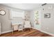 Cozy Bedroom with wood-look floors, rocking chair, changing table, and whimsical animal decor at 6137 Halifax Dr, New Port Richey, FL 34653