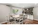 Bright dining room with wood floors and stylish sliding door to backyard at 6137 Halifax Dr, New Port Richey, FL 34653