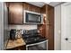 A closer view of the modern kitchen appliances including an oven and microwave at 6137 Halifax Dr, New Port Richey, FL 34653