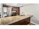 A kitchen with granite counters and stainless steel appliances provides plenty of storage and cooking space at 6137 Halifax Dr, New Port Richey, FL 34653
