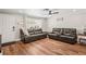 Bright living room with hardwood floors, comfortable seating, and stylish decor at 6137 Halifax Dr, New Port Richey, FL 34653