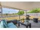 Inviting covered patio with comfortable seating and grill, perfect for outdoor gatherings and relaxation at 6137 Halifax Dr, New Port Richey, FL 34653