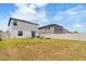 Spacious backyard features a swing set, lush grass, and privacy fence at 6180 Spring Crayfish Ave, New Port Richey, FL 34653