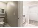 This half bathroom offers a pedestal sink and access to the walk-in closet for added convenience at 6180 Spring Crayfish Ave, New Port Richey, FL 34653