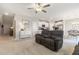 The cozy living room is located near the kitchen and dining area, perfect for relaxing and entertaining at 6180 Spring Crayfish Ave, New Port Richey, FL 34653