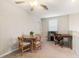 A spacious living area with a dining table, desk, and a play area that's perfect for a growing Gathering at 6180 Spring Crayfish Ave, New Port Richey, FL 34653