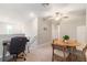 Bright loft space features a ceiling fan, study area, and table with chairs for flexible living at 6180 Spring Crayfish Ave, New Port Richey, FL 34653