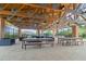 Outdoor pavilion with picnic tables, lounge seating, and wooden beams at 6180 Spring Crayfish Ave, New Port Richey, FL 34653