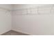 Spacious walk-in closet with ample shelving for organization and storage at 6180 Spring Crayfish Ave, New Port Richey, FL 34653