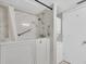 Bathroom featuring walk in tub with safety bars and in unit washer and dryer at 6400 46Th N Ave # 203, Kenneth City, FL 33709