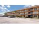 Spacious Willow Lake condo complex exterior showcasing ample parking and well-maintained landscaping at 6400 46Th N Ave # 203, Kenneth City, FL 33709