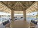 Gazebo lounge area with views of the community lake, seating and tables at 6400 46Th N Ave # 203, Kenneth City, FL 33709