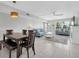 Bright living room featuring tile floors, stylish furniture, and a ceiling fan at 6400 46Th N Ave # 203, Kenneth City, FL 33709