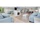 Spacious living room, complete with mirrors and an electric fireplace, and comfortable seating at 6400 46Th N Ave # 203, Kenneth City, FL 33709