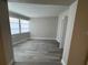Bedroom with gray wood flooring at 6407 1St Palm Pt, St Pete Beach, FL 33706
