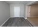 Bedroom with gray wood flooring at 6407 1St Palm Pt, St Pete Beach, FL 33706