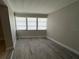Bedroom with multiple windows at 6407 1St Palm Pt, St Pete Beach, FL 33706