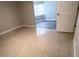 Bedroom showing the door leading to another room at 6407 1St Palm Pt, St Pete Beach, FL 33706
