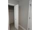 Bedroom closet features a shelf, ample storage, and a louvered door that complements the room at 6407 1St Palm Pt, St Pete Beach, FL 33706