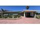 Charming single-story home with a covered carport and a beautifully paved brick driveway at 6407 1St Palm Pt, St Pete Beach, FL 33706