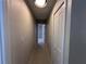 Neutral hallway with access to multiple rooms at 6407 1St Palm Pt, St Pete Beach, FL 33706