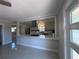 Gourmet kitchen featuring a large counter perfect for bar stool seating and stainless steel appliances at 6407 1St Palm Pt, St Pete Beach, FL 33706
