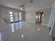 Bright living room with polished floors and a modern front door, perfect for welcoming guests at 6407 1St Palm Pt, St Pete Beach, FL 33706