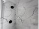 Marble tiled shower features black shower heads at 6407 1St Palm Pt, St Pete Beach, FL 33706