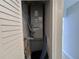 HVAC closet with bi-fold doors houses the home's central air conditioning unit and some items at 6407 1St Palm Pt, St Pete Beach, FL 33706