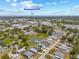 Beautiful aerial view showcases a home in a lush neighborhood with a pond and convenient access to Downtown St Pete at 6741 51St N Way, Pinellas Park, FL 33781