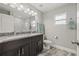 Modern bathroom with a double vanity, granite countertops, and ample lighting at 6741 51St N Way, Pinellas Park, FL 33781