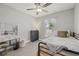 Cozy bedroom with a metal frame bed, white curtains, and a vanity at 6741 51St N Way, Pinellas Park, FL 33781