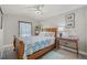 Comfortable bedroom featuring a bed, window, and nautical décor at 6741 51St N Way, Pinellas Park, FL 33781