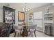 Cozy dining area featuring a unique round table, stylish chairs, and modern decor at 6741 51St N Way, Pinellas Park, FL 33781