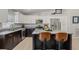 Modern kitchen boasting granite countertops, stainless steel appliances, and a kitchen island with seating at 6741 51St N Way, Pinellas Park, FL 33781