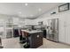 Modern kitchen featuring granite countertops, stainless steel appliances, and a central island with bar seating at 6741 51St N Way, Pinellas Park, FL 33781