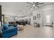 Spacious living room featuring an open-concept layout with access to the kitchen and dining areas at 6741 51St N Way, Pinellas Park, FL 33781