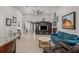 Spacious living room with hardwood flooring, large TV, and comfortable blue sofa at 6741 51St N Way, Pinellas Park, FL 33781