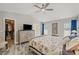 Main bedroom with a walk-in closet, vaulted ceilings, and neutral color scheme at 6741 51St N Way, Pinellas Park, FL 33781