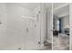 Walk-in shower featuring white marble, hexagon tiling, and modern fixtures at 6741 51St N Way, Pinellas Park, FL 33781
