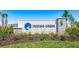Entrance to the community featuring professional landscaping and signage at 721 Steel Dr, Apollo Beach, FL 33572