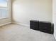 Neutral bedroom with a window, carpet flooring, and two sets of black plastic drawers at 7246 Bucks Ford Dr, Riverview, FL 33578