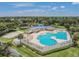 Aerial view of the large community pool, hot tub, and volleyball court at 7246 Bucks Ford Dr, Riverview, FL 33578