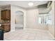 Open dining area with tile floors, a window, and archways to other living spaces at 7246 Bucks Ford Dr, Riverview, FL 33578