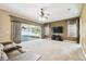 Inviting living room featuring a ceiling fan, large windows, and outdoor access at 7246 Bucks Ford Dr, Riverview, FL 33578