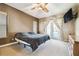 Main bedroom features a ceiling fan, private entry to the pool deck and an ensuite bathroom at 7246 Bucks Ford Dr, Riverview, FL 33578
