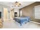 Main bedroom featuring a ceiling fan, carpet flooring, and ample closet space at 7246 Bucks Ford Dr, Riverview, FL 33578